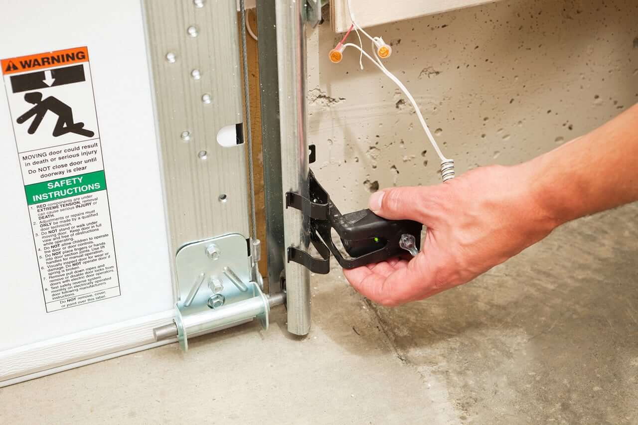 garage door sensor adjustment