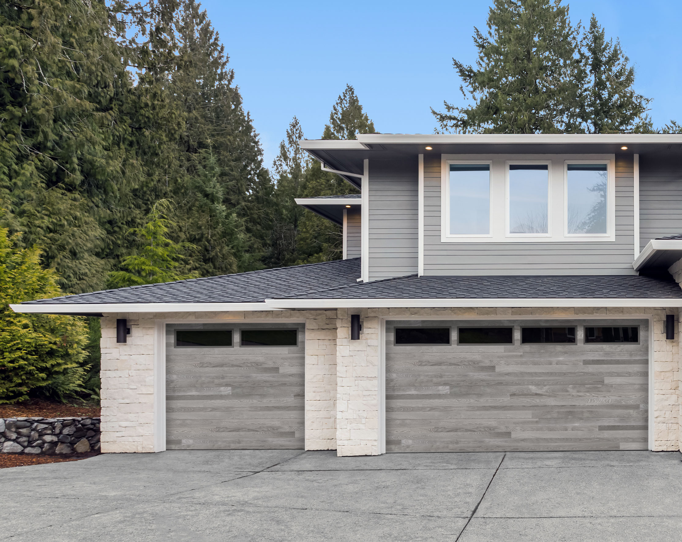 Steel gray single and double garage door with H-plank design and glazed windows