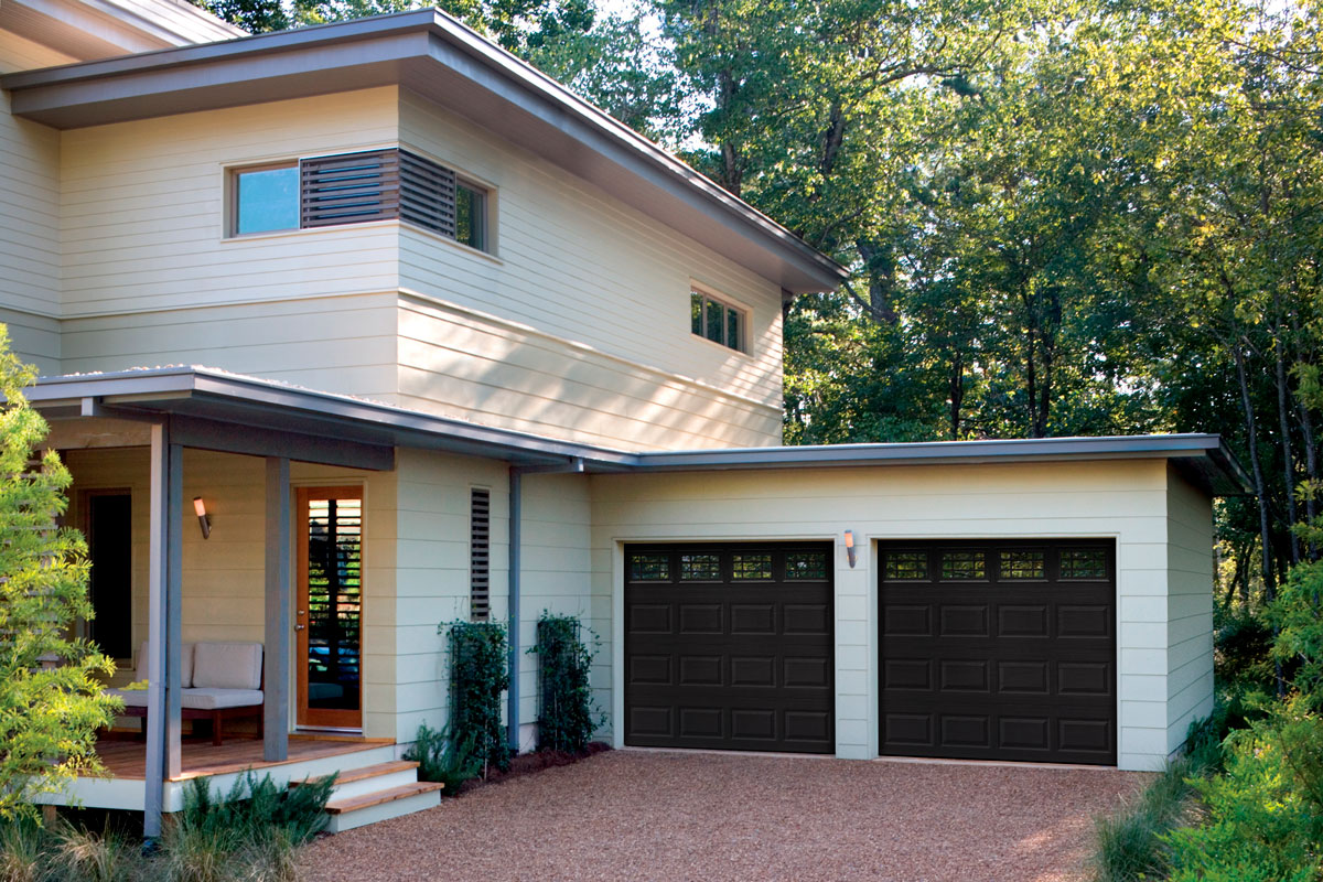 Black steel single garage door with short panel and glazed windows
